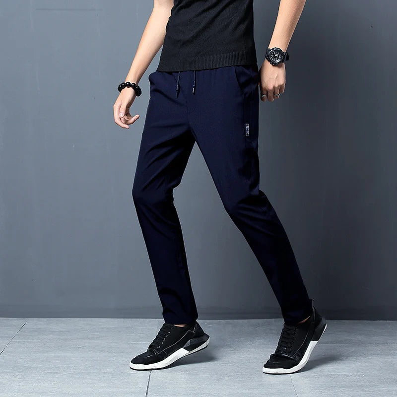 
                  
                    2024 New Men'S Korean Fashion Casual Summer Thin Quick Drying Ice Silk Straight Pants Loose Sports 9-Point Trousers Boy
                  
                