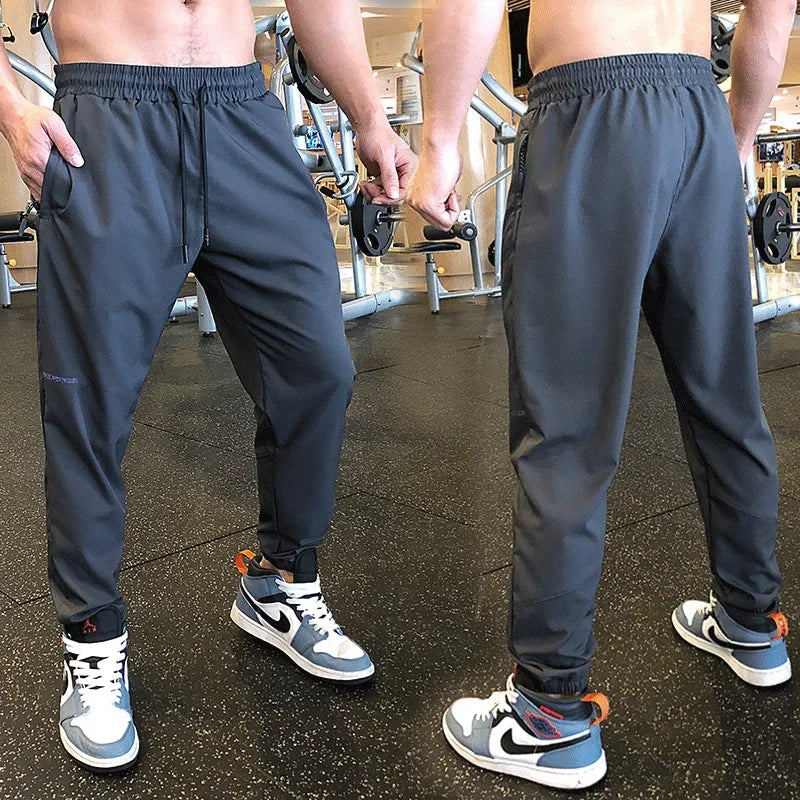 
                  
                    Men Sport Pant Training Bodybuilding Trousers Youngster Fitness Running Sweatpant Thin Elastic Dry Fit Zipper Pockets Long Pants
                  
                