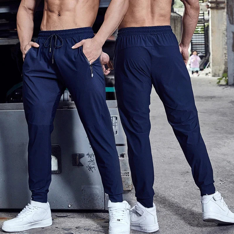 
                  
                    Men Sport Pant Training Bodybuilding Trousers Youngster Fitness Running Sweatpant Thin Elastic Dry Fit Zipper Pockets Long Pants
                  
                