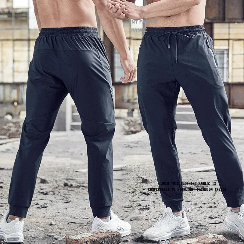 
                  
                    Men Sport Pant Training Bodybuilding Trousers Youngster Fitness Running Sweatpant Thin Elastic Dry Fit Zipper Pockets Long Pants
                  
                