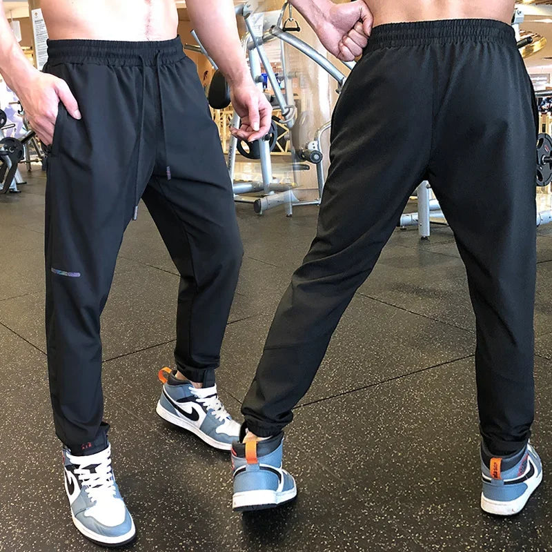 
                  
                    Men Sport Pant Training Bodybuilding Trousers Youngster Fitness Running Sweatpant Thin Elastic Dry Fit Zipper Pockets Long Pants
                  
                