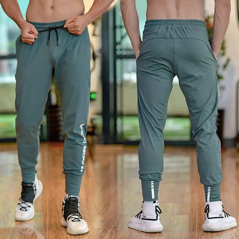 
                  
                    Men Sport Pant Training Bodybuilding Trousers Youngster Fitness Running Sweatpant Thin Elastic Dry Fit Zipper Pockets Long Pants
                  
                