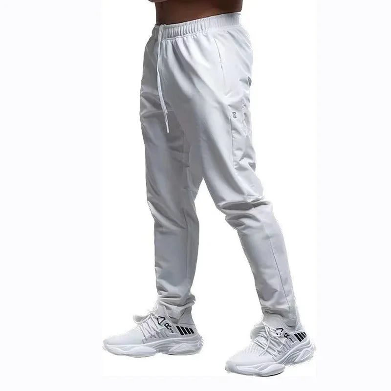 
                  
                    Breathable Loose Running Pants Men Autumn Winter Sport Training Gym Sportswear Elastic Waterproof Outdoor Zip Pocket Sweatpant
                  
                