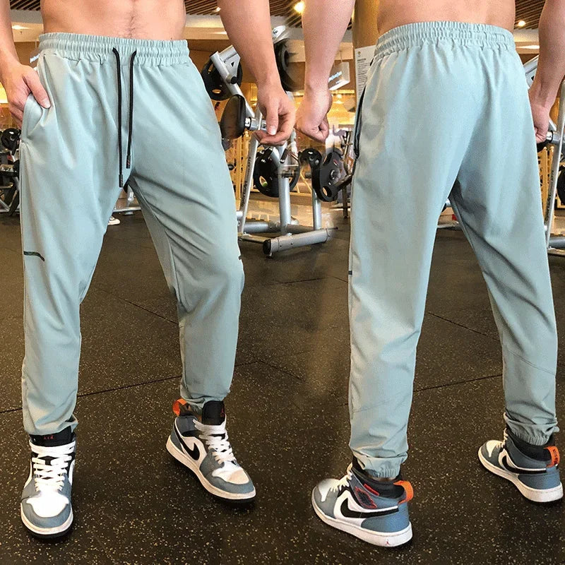 
                  
                    Men Sport Pant Training Bodybuilding Trousers Youngster Fitness Running Sweatpant Thin Elastic Dry Fit Zipper Pockets Long Pants
                  
                