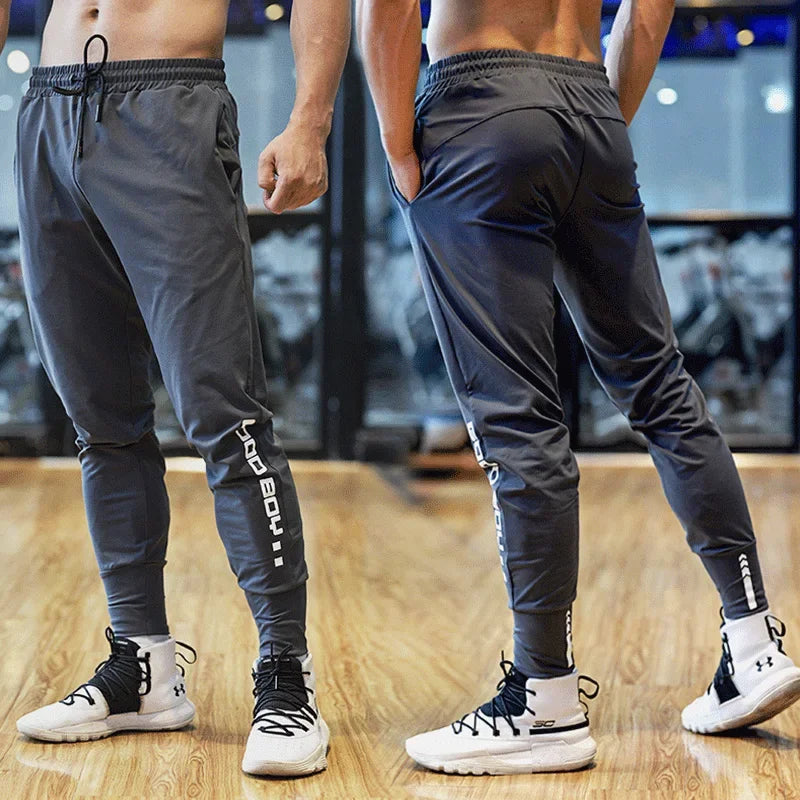 
                  
                    Men Sport Pant Training Bodybuilding Trousers Youngster Fitness Running Sweatpant Thin Elastic Dry Fit Zipper Pockets Long Pants
                  
                