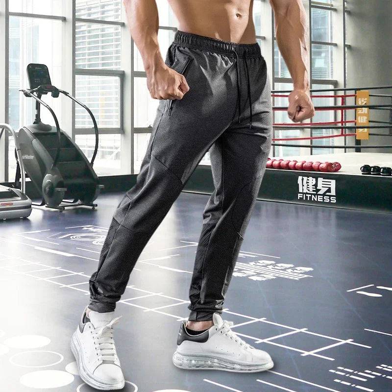 
                  
                    Mens Gym Fitness Running Sweatpants Workout Athletic Long Pants Outdoor Training Sports Trousers Elastic Waist Zipper Pockets
                  
                