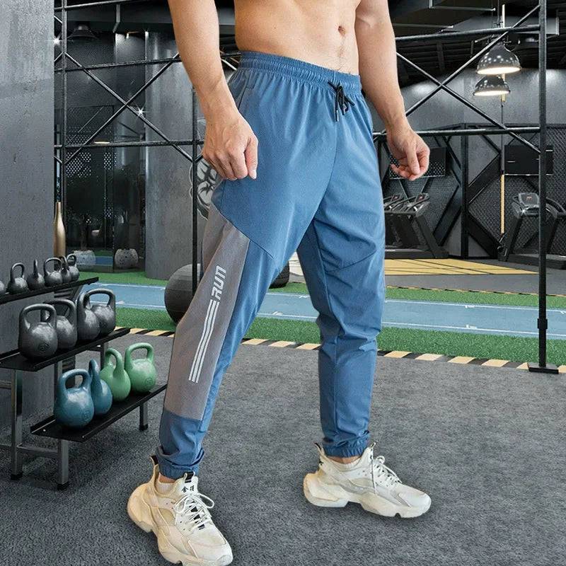 
                  
                    Mens Gym Fitness Running Sweatpants Workout Athletic Long Pants Outdoor Training Sports Trousers Elastic Waist Zipper Pockets
                  
                