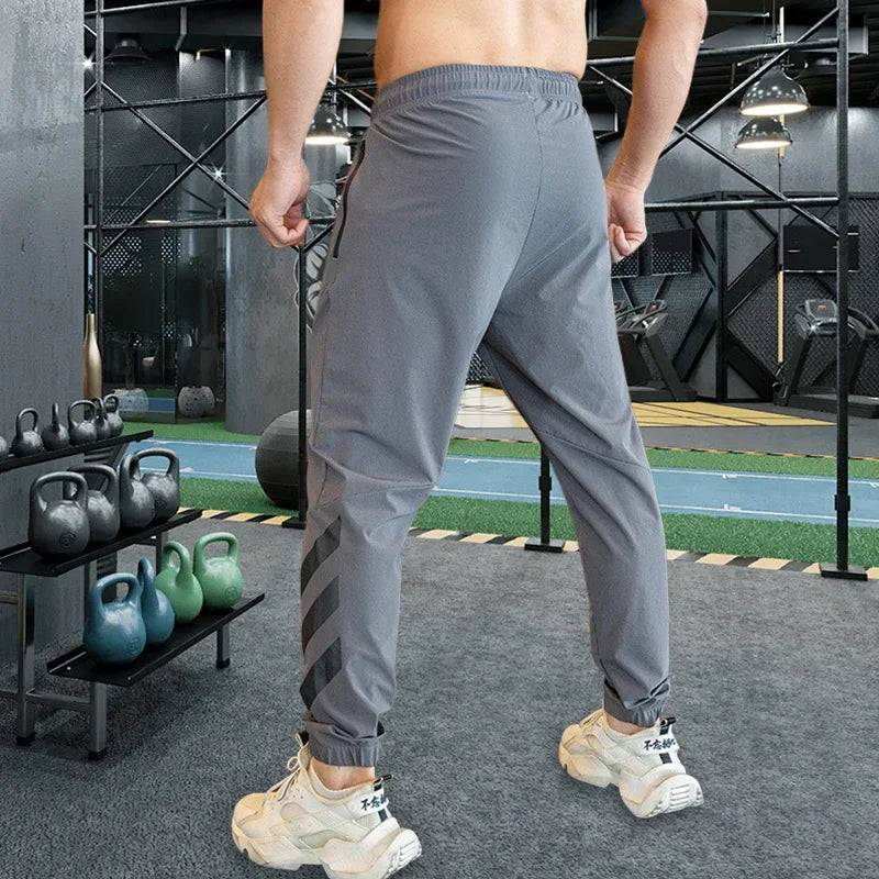 
                  
                    Mens Gym Fitness Running Sweatpants Workout Athletic Long Pants Outdoor Training Sports Trousers Elastic Waist Zipper Pockets
                  
                