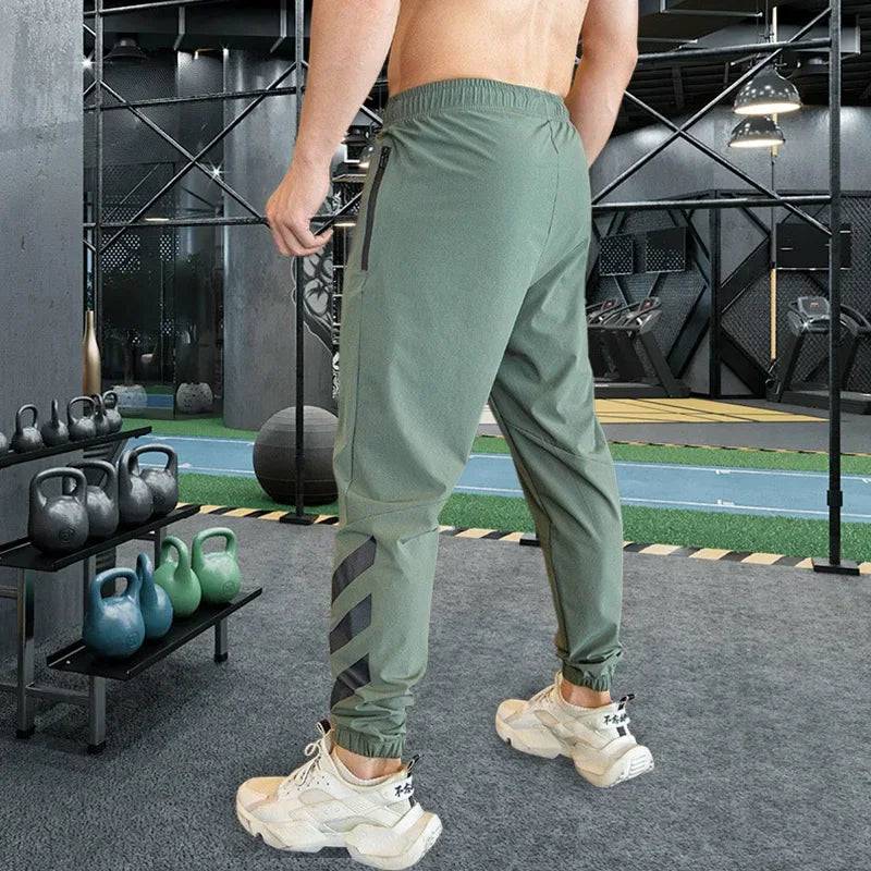 
                  
                    Mens Gym Fitness Running Sweatpants Workout Athletic Long Pants Outdoor Training Sports Trousers Elastic Waist Zipper Pockets
                  
                