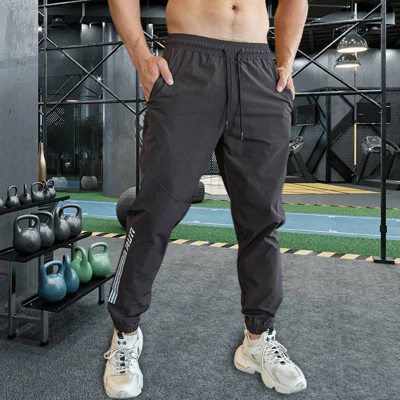 
                  
                    Mens Gym Fitness Running Sweatpants Workout Athletic Long Pants Outdoor Training Sports Trousers Elastic Waist Zipper Pockets
                  
                